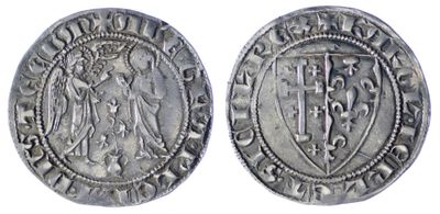 une pièce d'argent sur laquelle figurent des armoiries et un bouclier