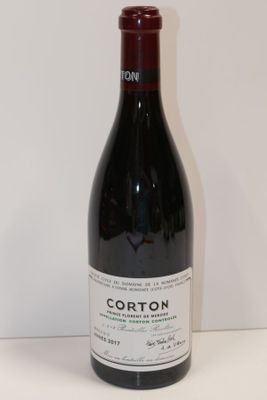 a bottle of wine that is sitting on a table