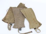 three pairs of leather mitts on a white background