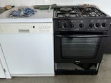 a stove and a dishwasher in a small kitchen