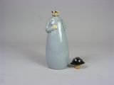 a figurine of a penguin and a bird on a white background