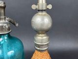 two glass bottles that are next to each other on a table