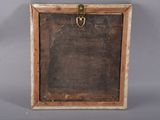 an old wooden picture frame with a metal latch on it