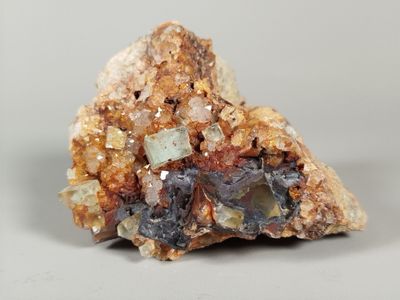 a piece of rock that has a lot of crystals on it