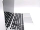 a close up of a laptop computer on a white surface