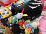 a pile of baby toys and toys on the floor
