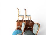 four chairs and a desk with a mirror on it