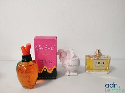 a bottle of perfume and a box of perfume on a table