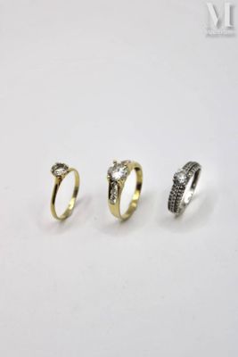 three different types of rings on a white surface