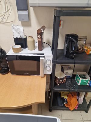 a microwave and a microwave oven on a small table