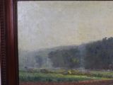 a picture of a painting of a landscape in a brown frame