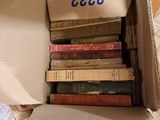 a box full of books sitting on the floor