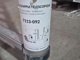 a sticker on a pole that has a sign on it