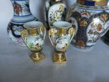 three vases that are sitting next to each other on a table