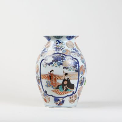 a vase with a picture of a woman and a man sitting on a bench