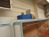 an image of a dirty kitchen with a blue bucket on the counter