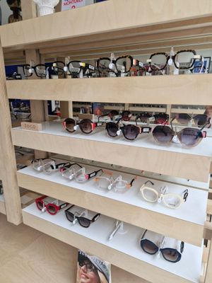 many glasses on the shelves in the store