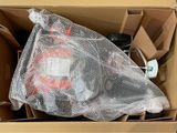 a cardboard box with a bag of items inside of it