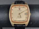 a close up of a wrist watch on a stand