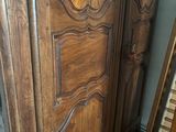 a wooden door with a green sticker on it