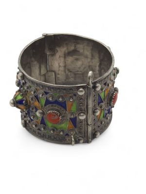 an image of a silver bracelet with multi colored stones on it