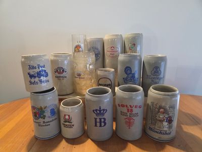 many different types of beer mugs on the table