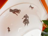 a cup with a picture of a girl and a horse on it