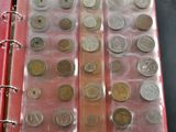 many different types of coins in a red binder