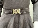 an image of a woman wearing a belt with a gold buckle