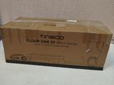 a box that is sitting on a table with a remote