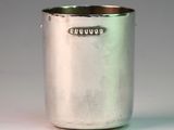 a silver cup that is sitting on a table