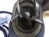 a close up of a helmet on a person ' s feet