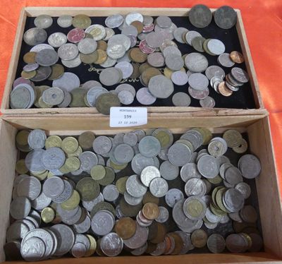 a lot of coins in a box on a table