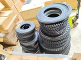 many tires stacked on top of each other in a pile