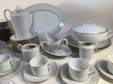 a lot of plates and cups on the table