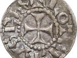une image représentant une pièce d'argent sur laquelle figure une croix
