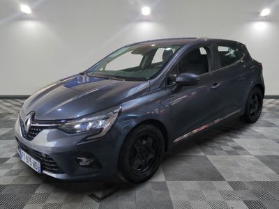 a grey car is parked in a room with a checkered floor