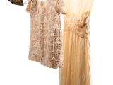 three dresses hanging on a clothes line on a white background