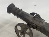 a cannon that is sitting on the ground in the snow
