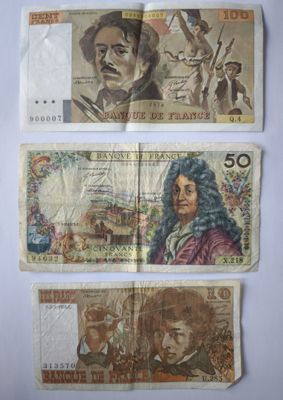 trois billets de banque différents portant l'image d'un homme et d'une femme