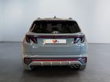 the rear end of a silver suv parked in a showroom