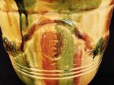 a close up of a vase on a black background