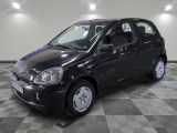 a picture of a small black car parked on a checkered floor