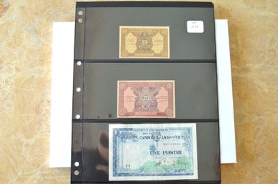 trois types différents de billets de banque posés sur une table