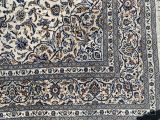 an image of a rug on a wooden floor next to a wall