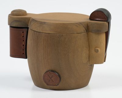a wooden cup that has a handle on it