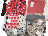 many different types of clothing in bags on a white background