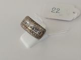 a close up of a ring on a white surface with a price tag