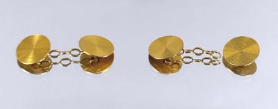 two pairs of gold plated cufflinks on a white background