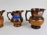 three different types of vases sitting on a white surface